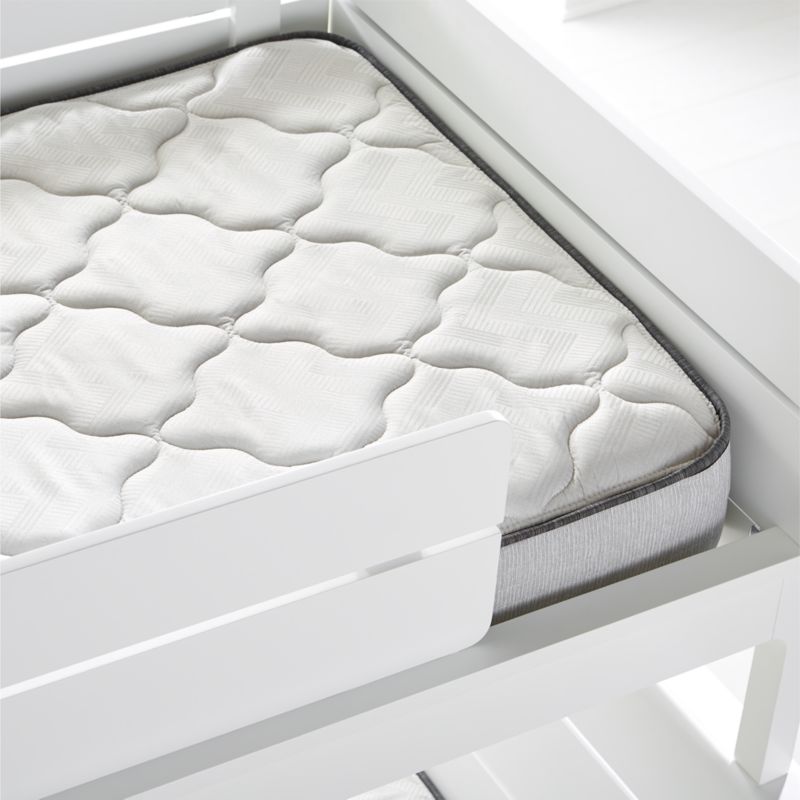 white bunk beds with mattresses