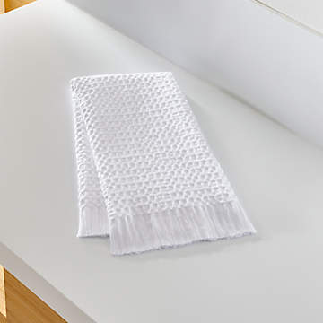 https://cb.scene7.com/is/image/Crate/SolaWhiteGuestTowelSHS19/$web_recently_viewed_item_sm$/220913144028/sola-white-guest-towel.jpg