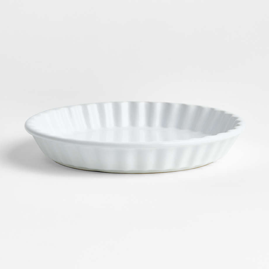 https://cb.scene7.com/is/image/Crate/SorrentoQuicheDishSSS23/$web_pdp_main_carousel_med$/221006171313/sorrento-white-ceramic-quiche-dish.jpg