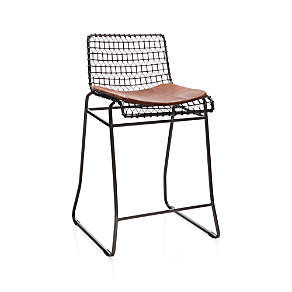 https://cb.scene7.com/is/image/Crate/Tig24InCountrStlLthrCushion3QF16/$web_pdp_carousel_low$/220913133248/tig-counter-stool-with-brown-leather-cushion.jpg