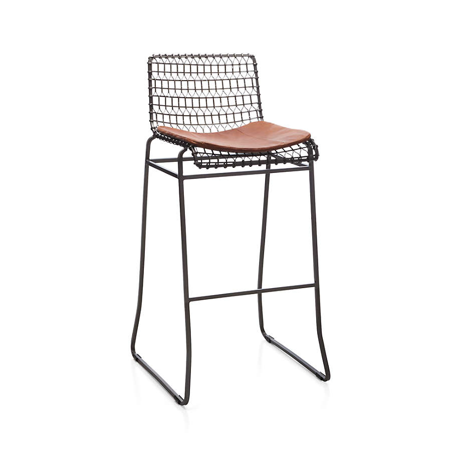 https://cb.scene7.com/is/image/Crate/Tig30InBarStoolLthrCushion3QF16/$web_pdp_main_carousel_med$/220913133248/tig-bar-stool-with-brown-leather-cushion.jpg