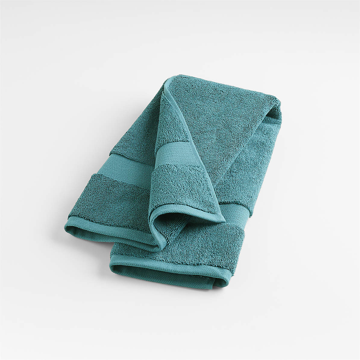 https://cb.scene7.com/is/image/Crate/TurkishOrg800HndTwlTealSSS22/$web_pdp_main_carousel_zoom_med$/220221114454/organic-800-gram-teal-turkish-hand-towel.jpg