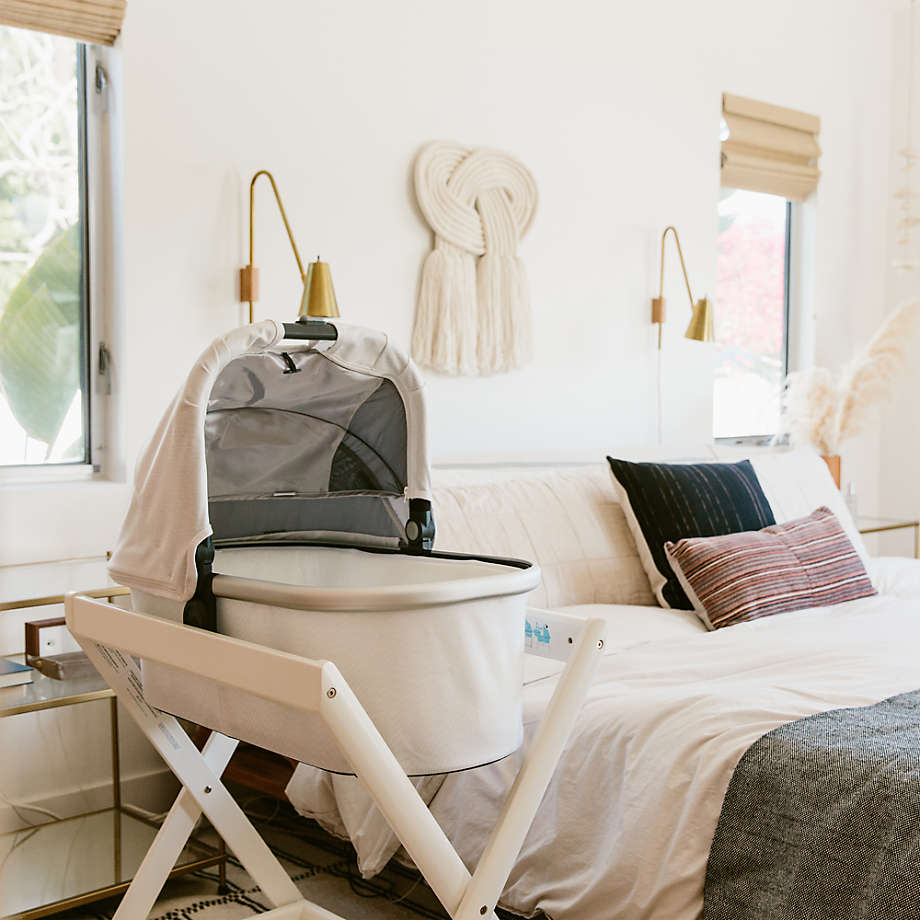 Bassinet stand with outlet wheels