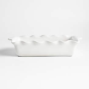 https://cb.scene7.com/is/image/Crate/WhiteRuffledRecBakingDshSSF22/$web_pdp_carousel_low$/220606130043/white-ruffled-rectangular-baking-dish.jpg
