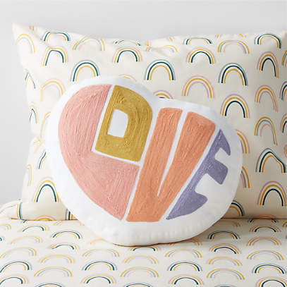 https://cb.scene7.com/is/image/Crate/WoodstockThrowPillowSSF22/$web_pdp_main_carousel_low$/220812134720/heart-shaped-kids-throw-pillow.jpg