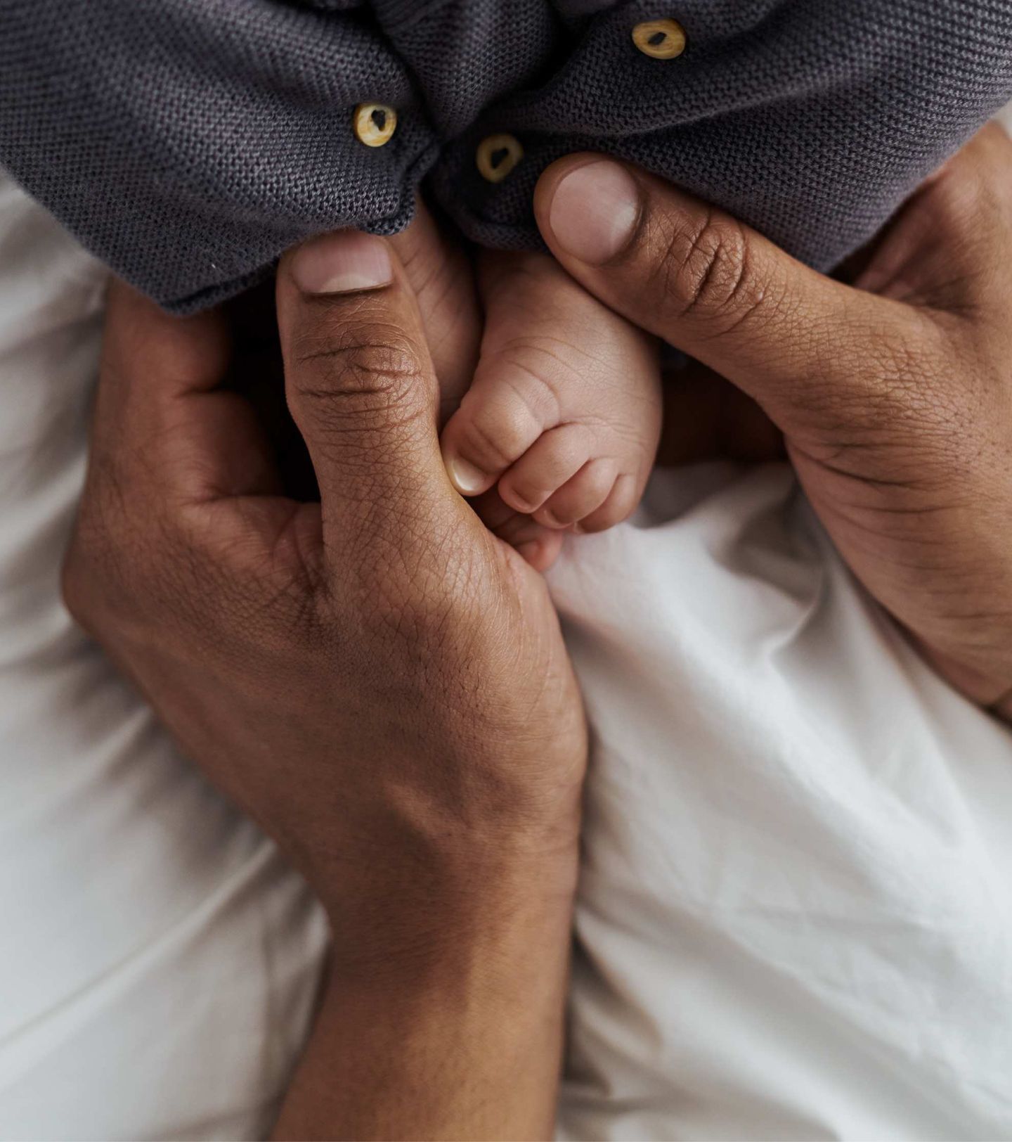 holding cute baby feet