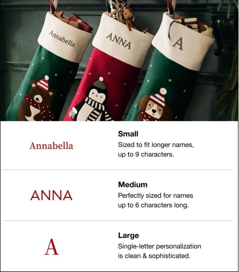 A sizing guide showing three personalized Christmas stockings and text font options. Top: Green stocking with a bear named 'Annabella', red stocking with a penguin named 'ANNA', and green stocking with a dog featuring letter 'A'. Bottom details: Small font fits longer names up to 9 characters (example: Annabella). Medium font fits names up to 6 characters (example: ANNA). Large font is for single-letter personalization (example: A).