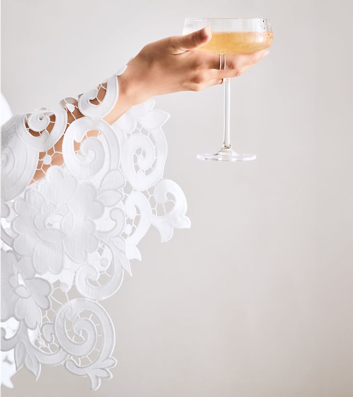 hand holding a champagne glass