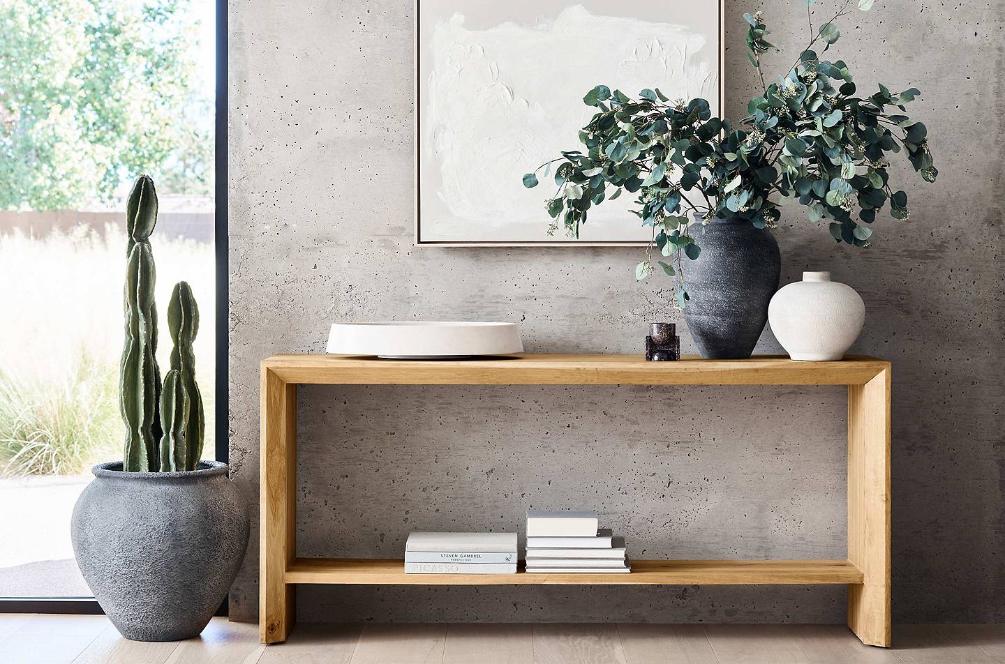 Entryway table with various Ophelia vases and botanicals