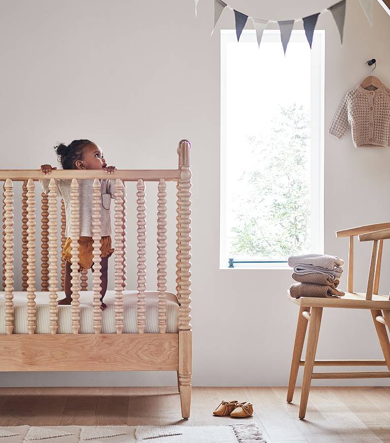 Infant in outlet crib