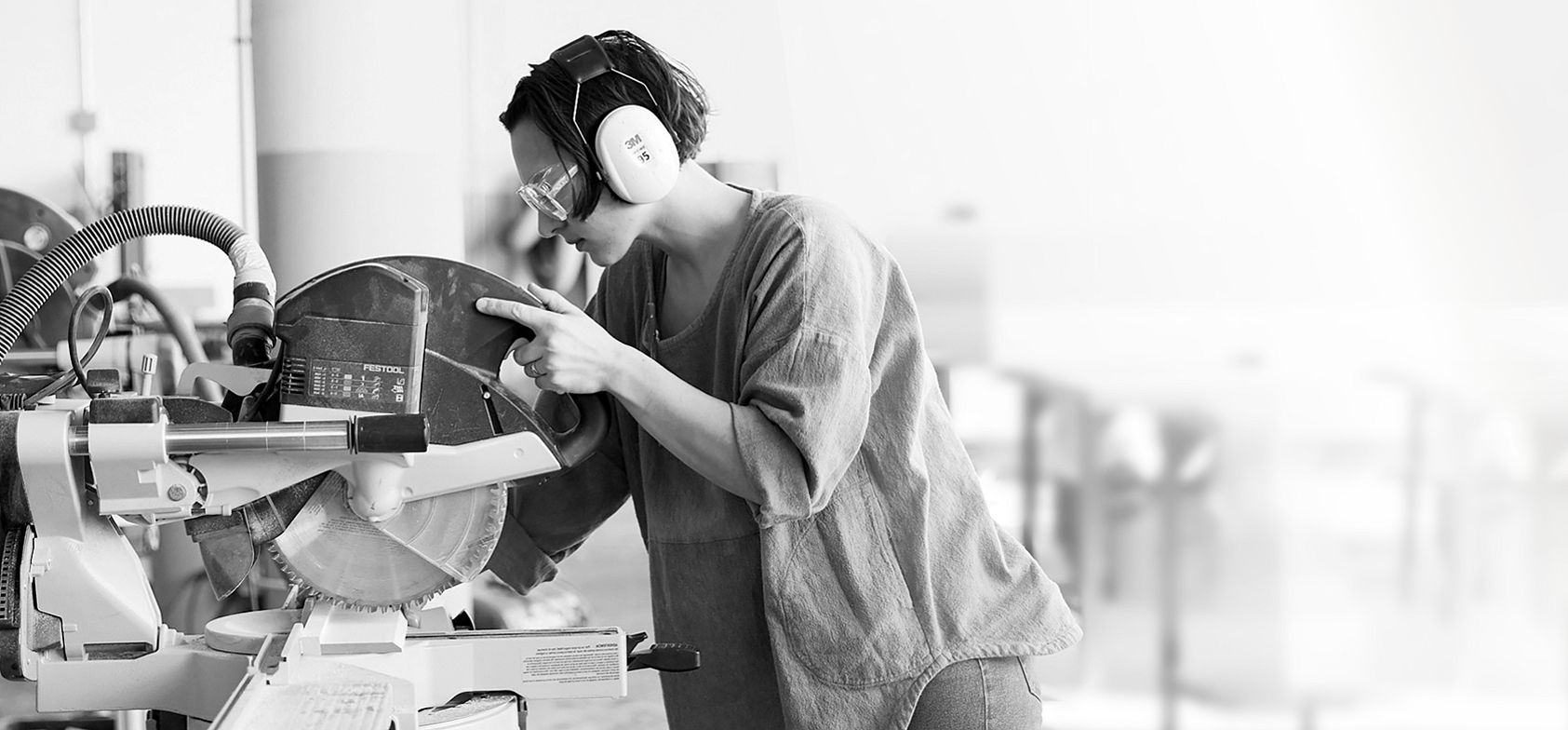 Woman using table saw