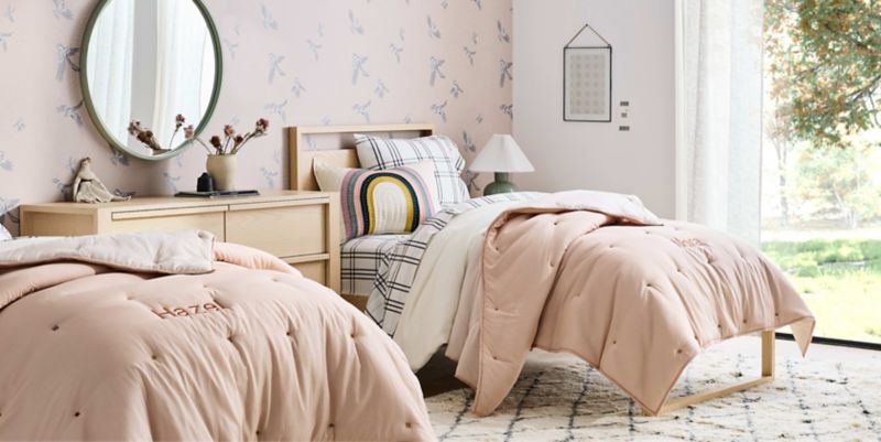 bedroom with two beds and a dresser